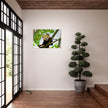 Acrylglas wanddecoratie van een rode panda tussen de groene bladeren